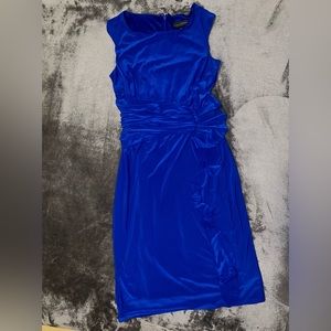 Elegant royal blue, ruffled dress giving great definition to your curves.